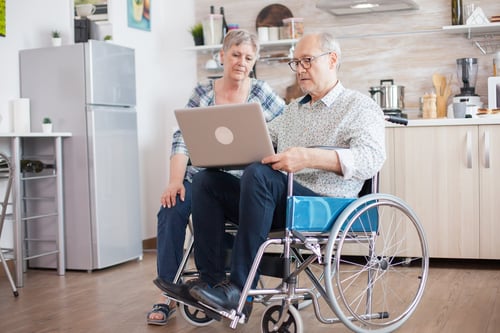 disabled-senior-man-wheelchair-his-wife-talking-with-family-via-video-conference-tablet-pc-kitchen-paralyzed-old-man-his-wife-having-online-conference